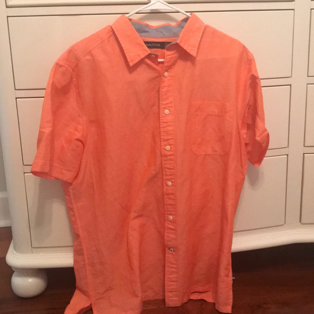 Light orange button down collared T-shirt